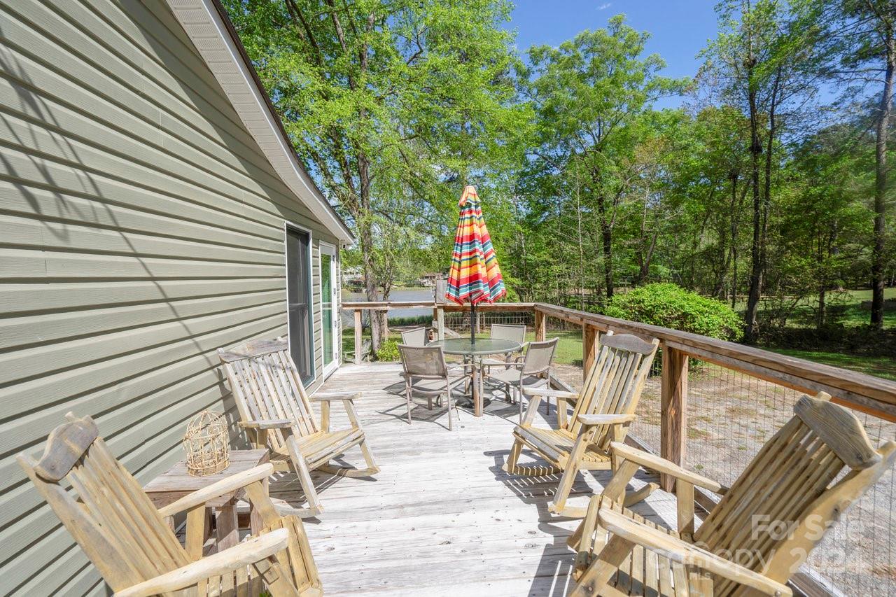 1405 Deer Run Road Ridgeway, SC 29130 - Photo 26 of 48 a view of balcony with furniture and trees