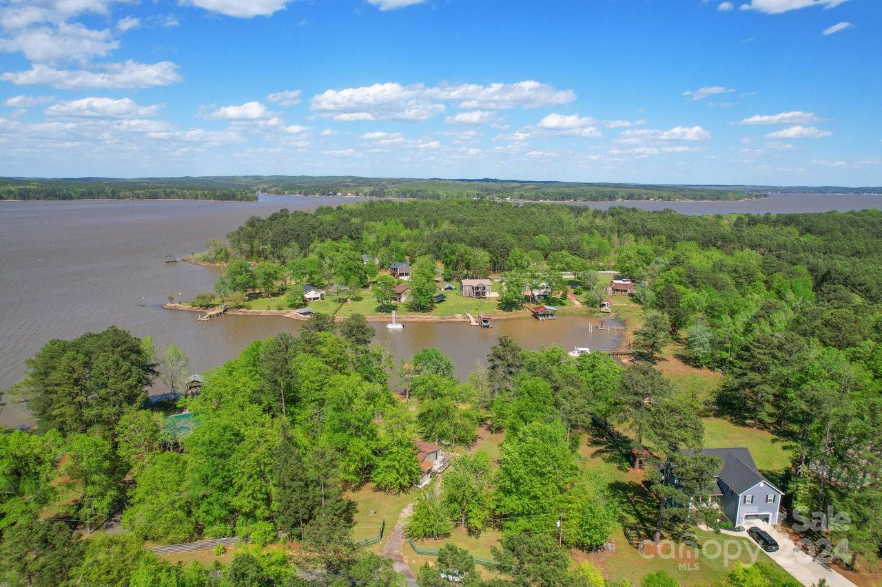 1405 Deer Run Road Ridgeway, SC 29130 - Photo 38 of 48 a view of a lake with houses in the back