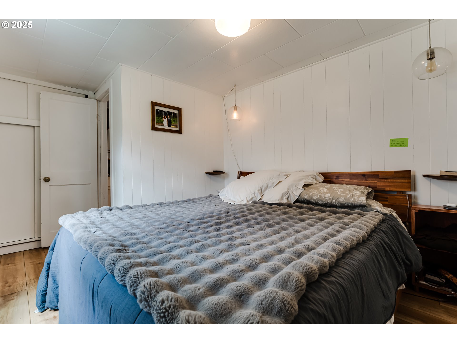 144 West K Street Springfield, OR 97477 - Photo 17 of 33 a bedroom with a bed and a night stand