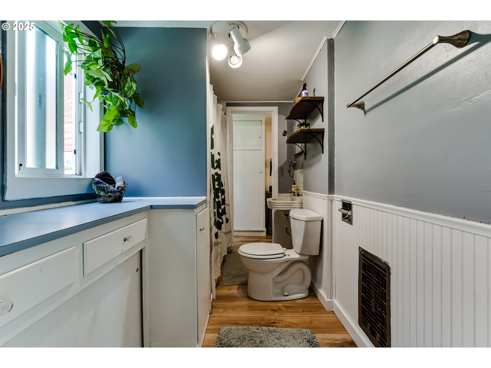 144 West K Street Springfield, OR 97477 - Photo 20 of 33 a bathroom with a toilet sink and mirror