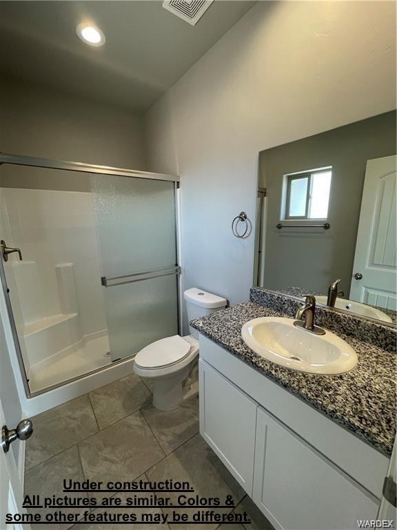 3595 North Verdugo Road Kingman, AZ 86409 - Photo 15 of 21 Bathroom featuring a shower with a sliding glass door, a toilet, a vanity with a granite countertop, an undermount sink, and white cabinetry