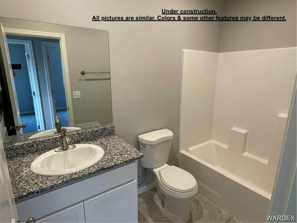 3595 North Verdugo Road Kingman, AZ 86409 - Photo 18 of 21 Bathroom featuring a white vanity cabinet with a granite-look countertop and an integrated sink