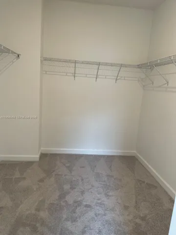 a bathroom with a toilet and a bathtub