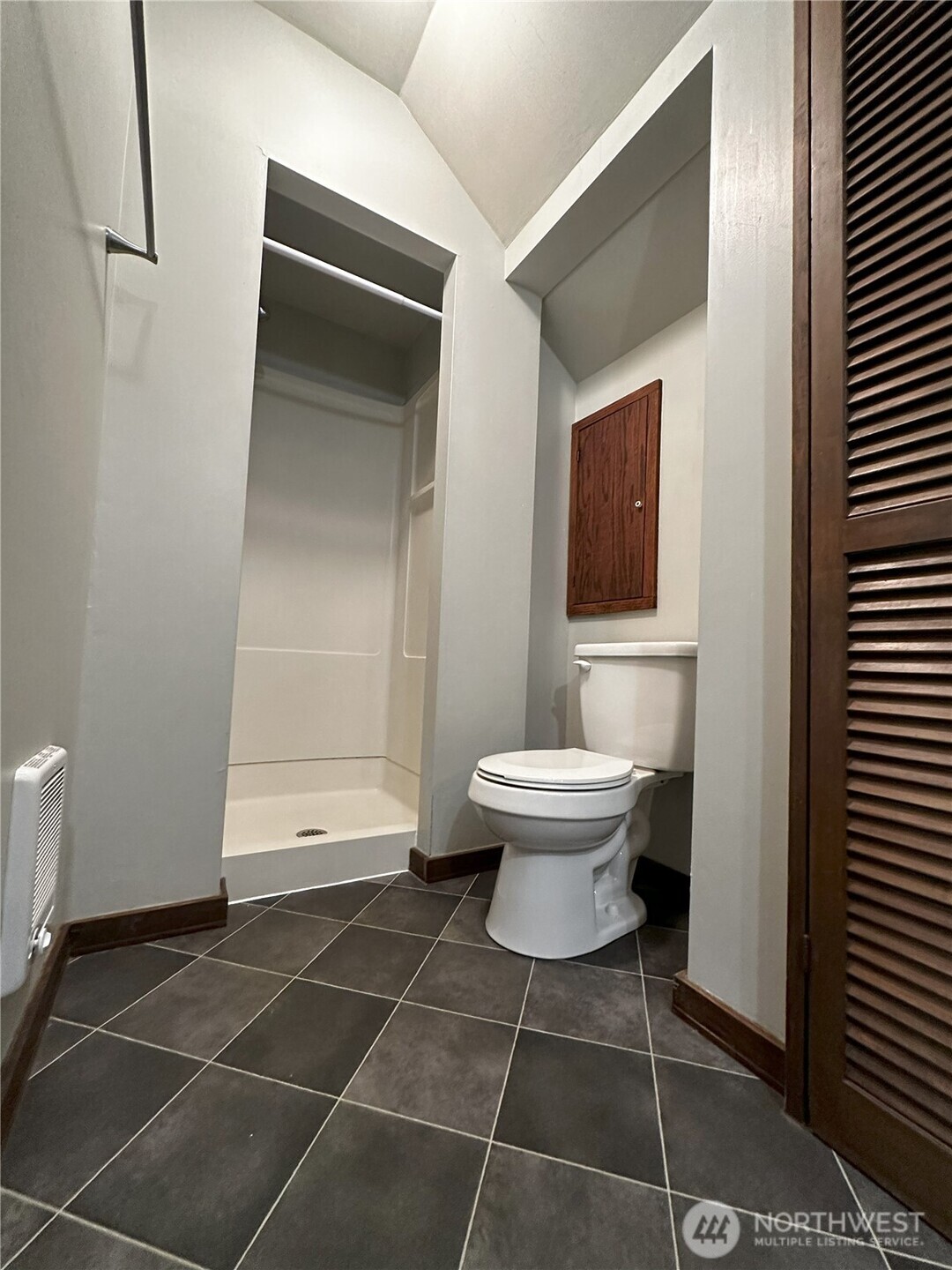 417 Minor Avenue North Seattle, WA 98109 - Photo 19 of 36 a bathroom with a toilet and a shower