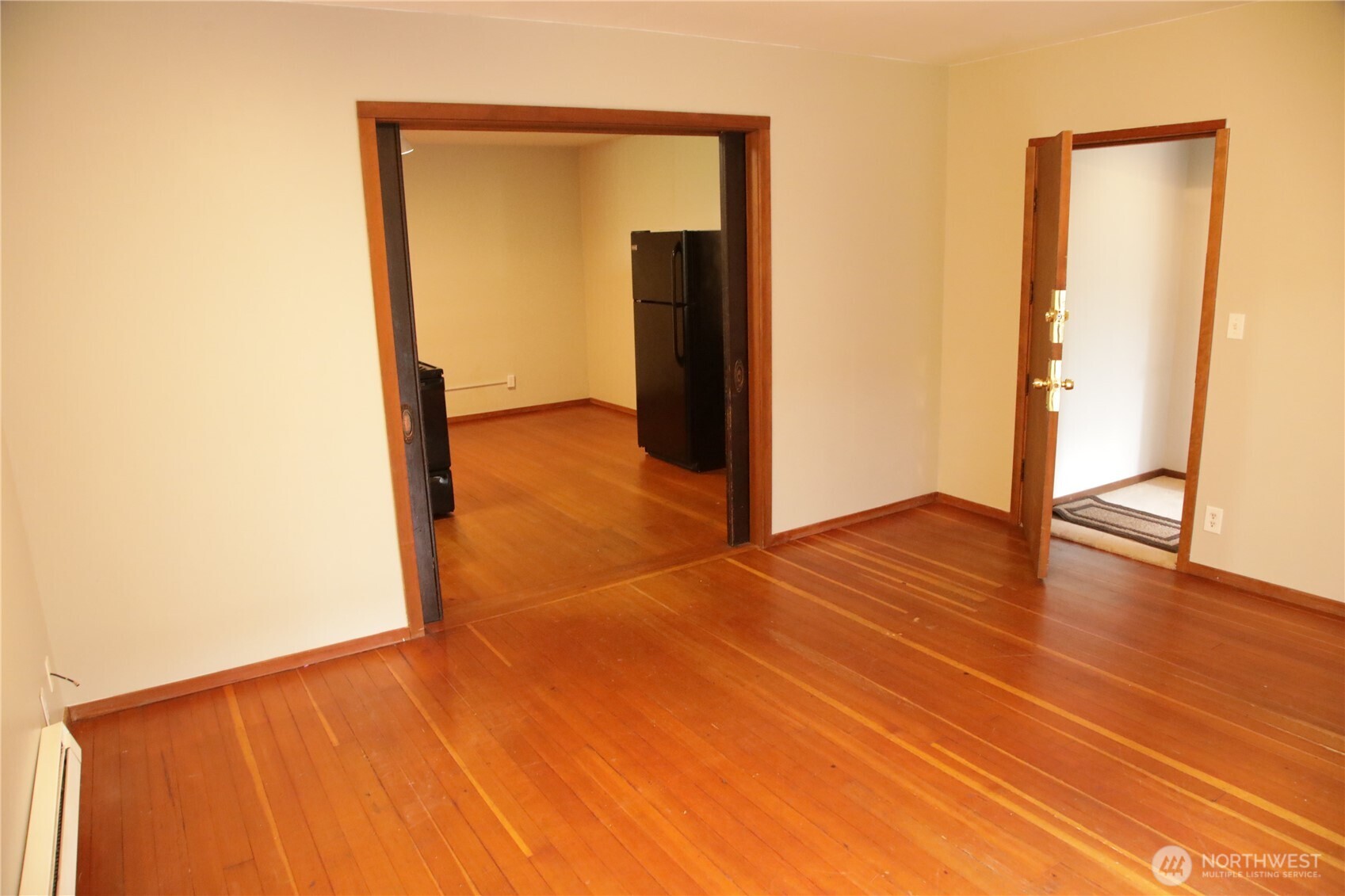 417 Minor Avenue North Seattle, WA 98109 - Photo 21 of 36 a view of a room with wooden floor and a hallway