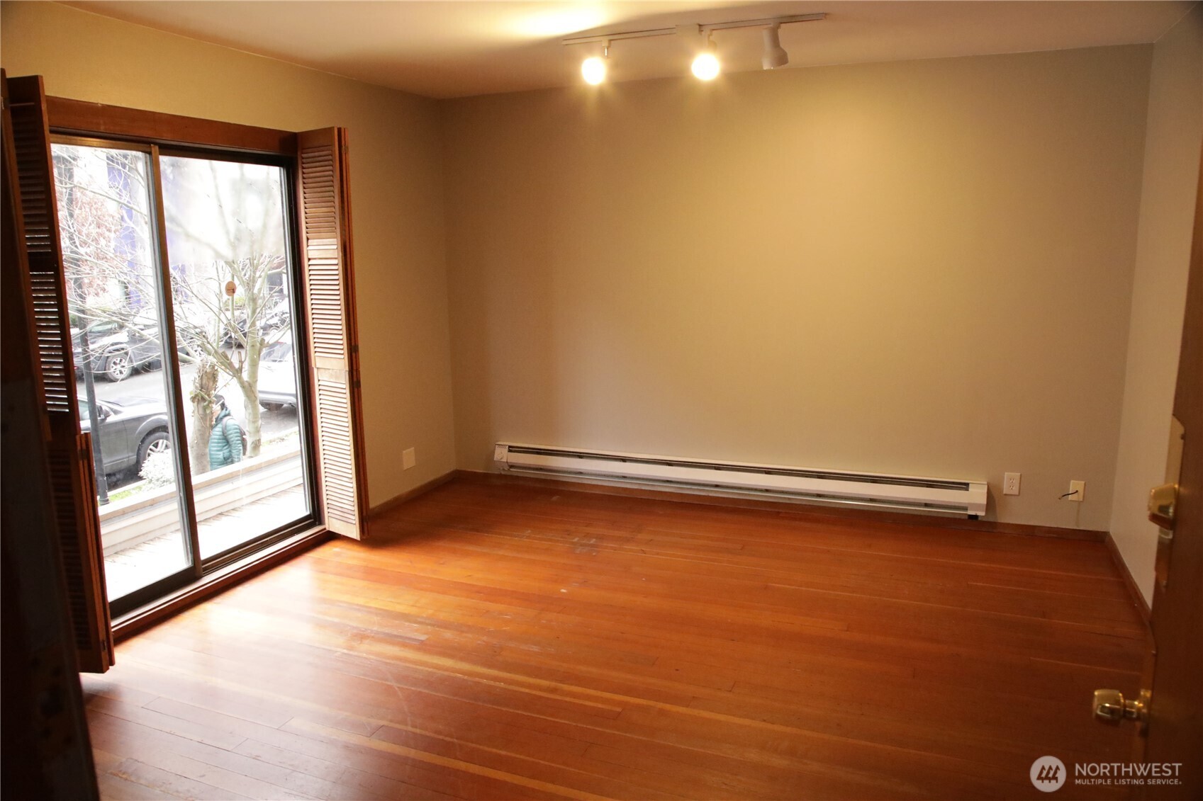 417 Minor Avenue North Seattle, WA 98109 - Photo 22 of 36 a view of a room with wooden floor and doors