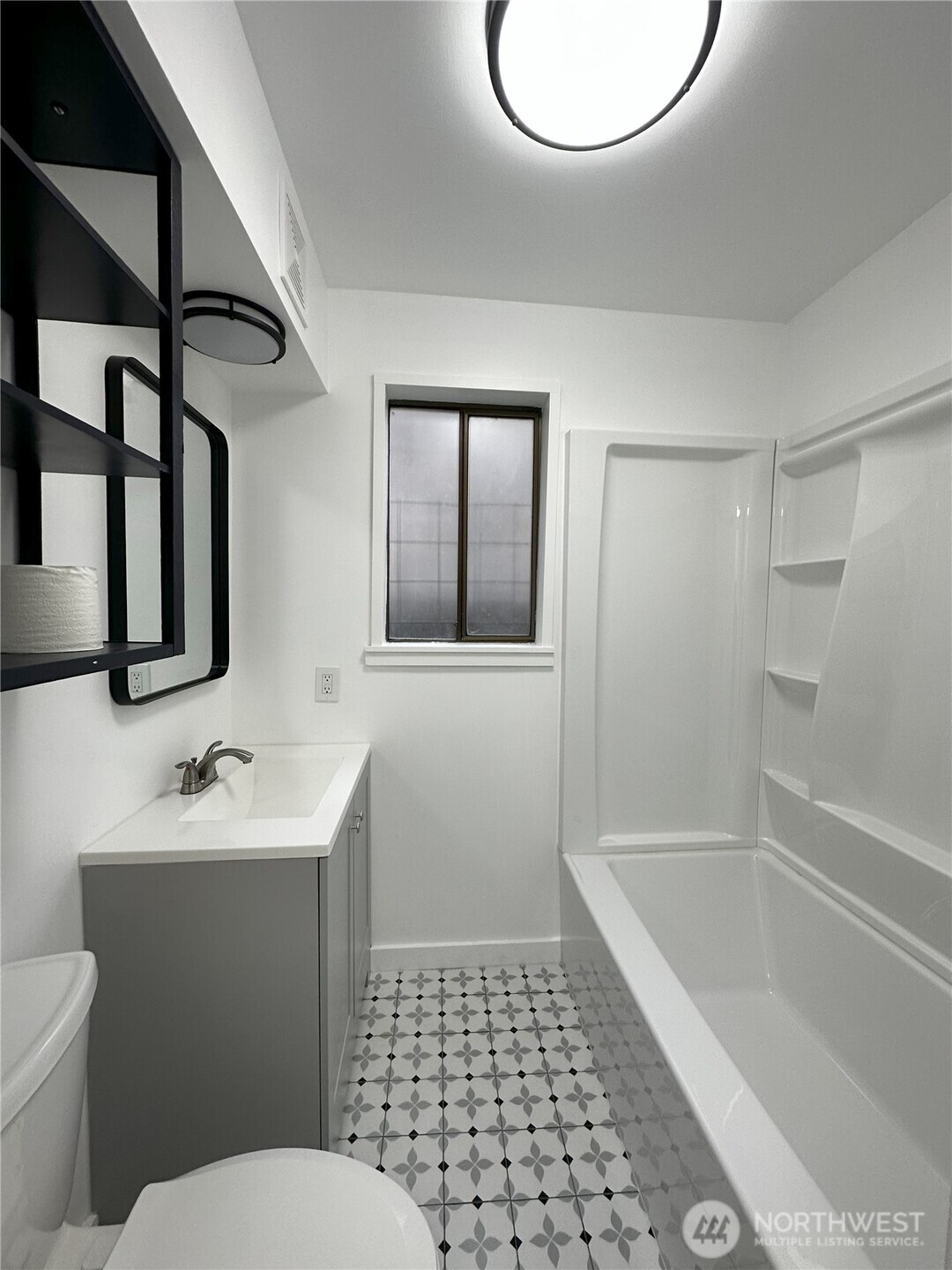 417 Minor Avenue North Seattle, WA 98109 - Photo 24 of 36 a bathroom with a sink a toilet and shower