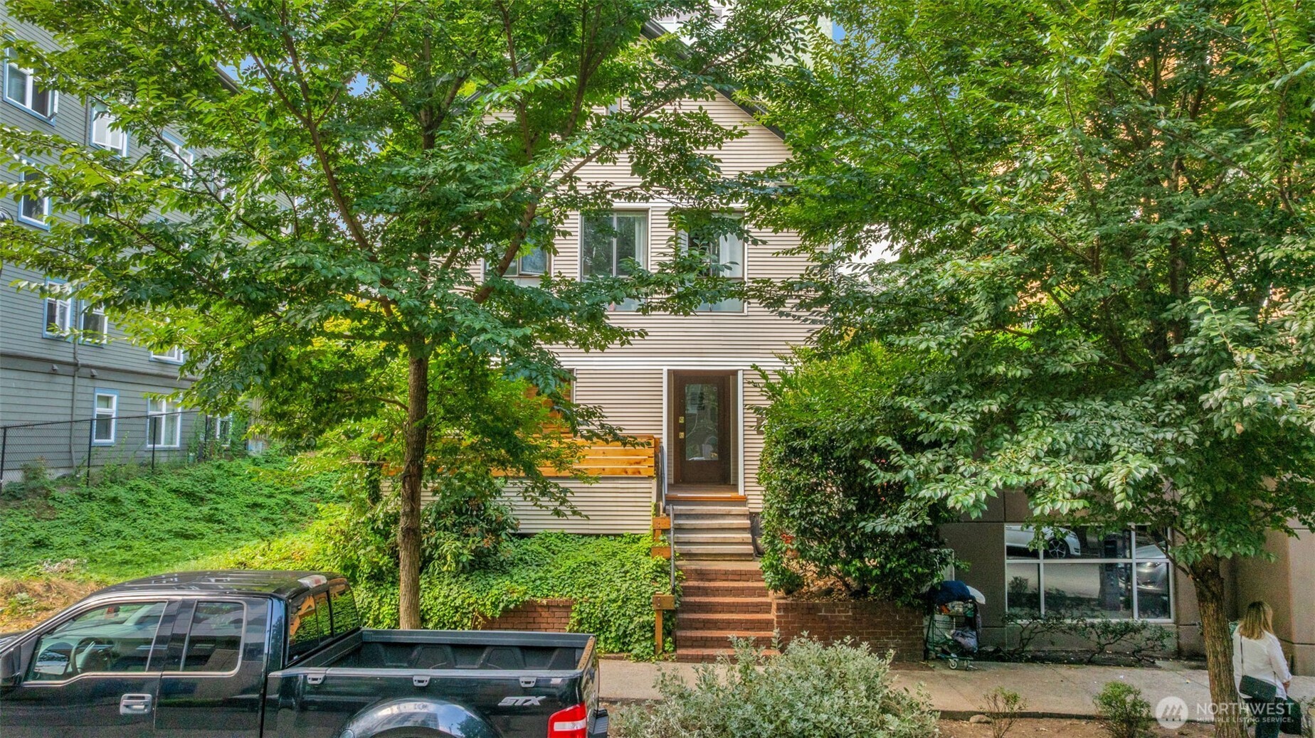 417 Minor Avenue North Seattle, WA 98109 - Photo 3 of 36 a front view of a house with a garden