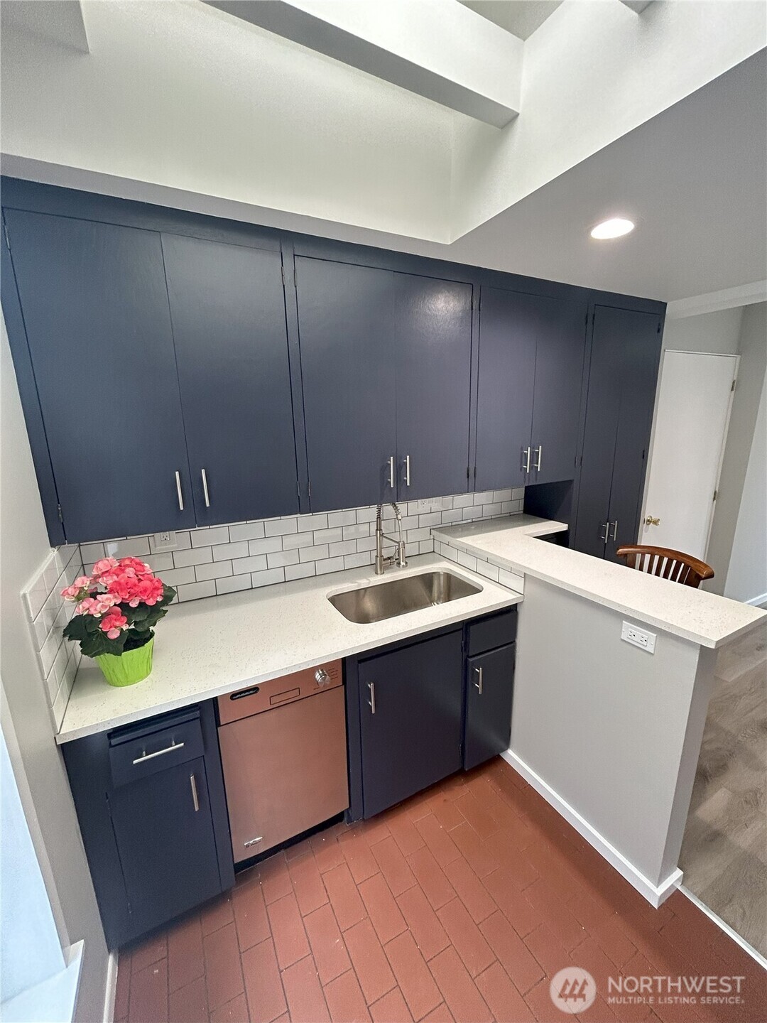 417 Minor Avenue North Seattle, WA 98109 - Photo 32 of 36 a kitchen with a sink and cabinets