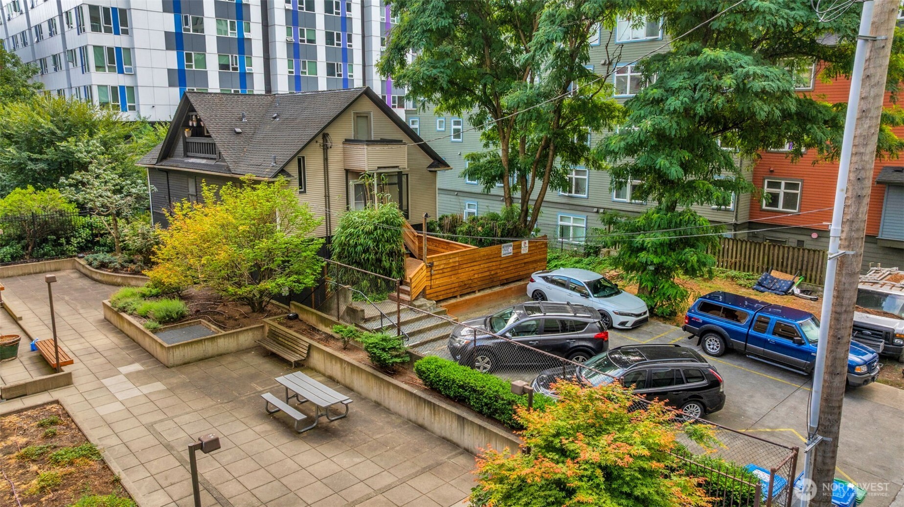 417 Minor Avenue North Seattle, WA 98109 - Photo 4 of 36 a view of a patio with table and chairs potted plants