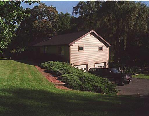 a front view of house with garden