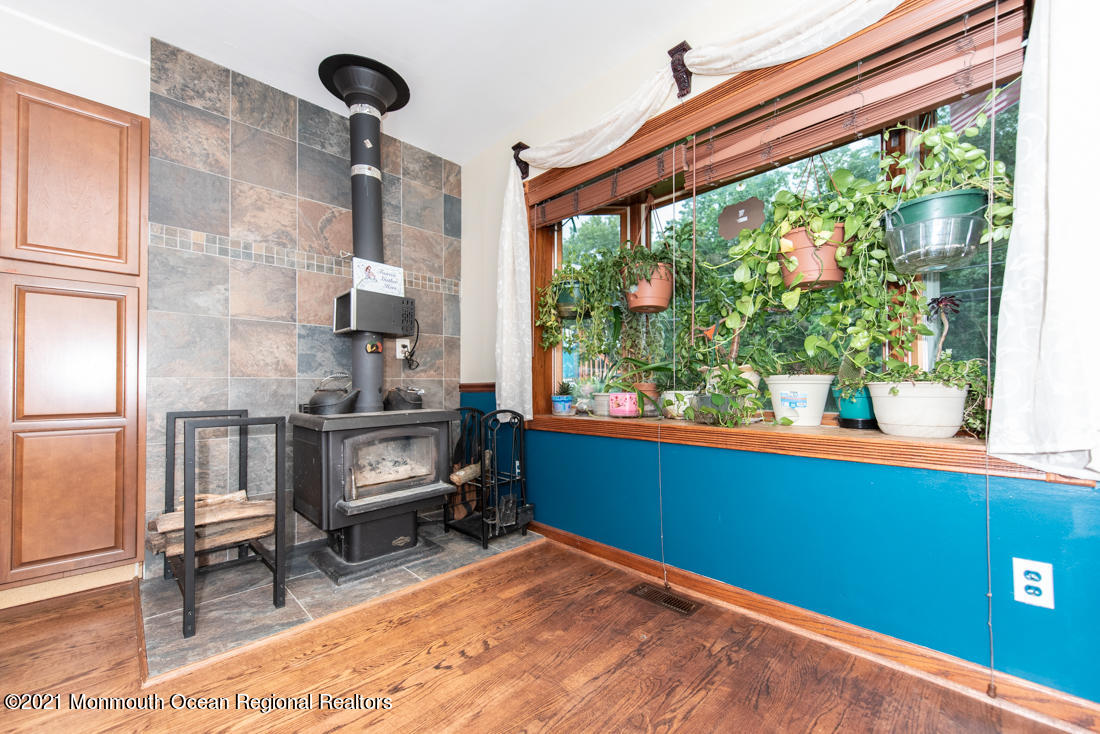 490 Hyson Road Jackson, NJ 08527 - Photo 11 of 47 Wood burning stove in den