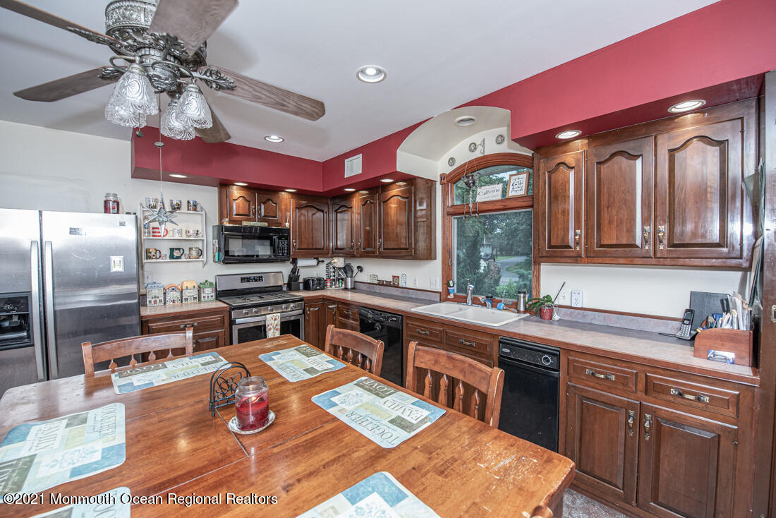 490 Hyson Road Jackson, NJ 08527 - Photo 16 of 47 Kitchen with cherry cabinets