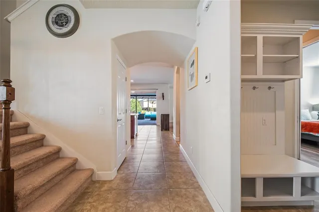 a dining room with furniture and a large window