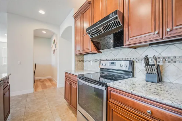 a living room with kitchen island furniture and a kitchen view