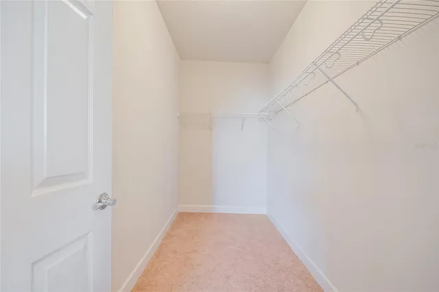 a view of a patio with dining table and chairs with wooden floor and fence
