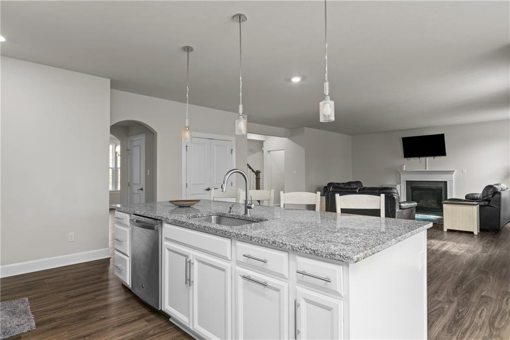 2006 Dantry Dr. Canonsburg, PA 15317 - Photo 14 of 32 a kitchen with stainless steel appliances granite countertop a sink a microwave and wooden floor