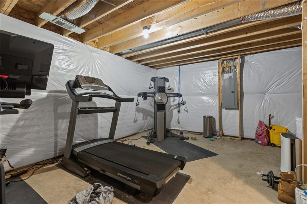 2006 Dantry Dr. Canonsburg, PA 15317 - Photo 32 of 32 a room with gym equipment and a flat screen tv