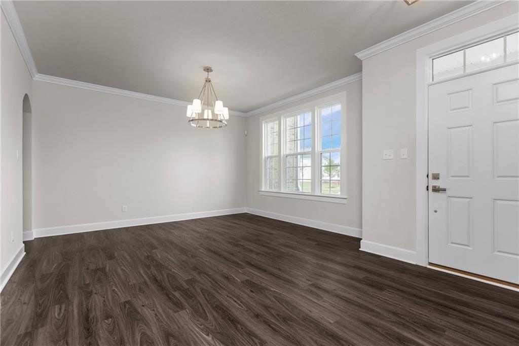2006 Dantry Dr. Canonsburg, PA 15317 - Photo 5 of 32 a view of an empty room with wooden floor and a window