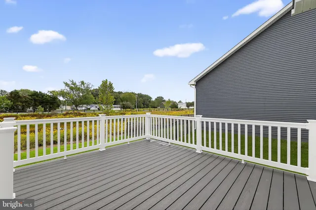 a view of deck with wooden floor and fence