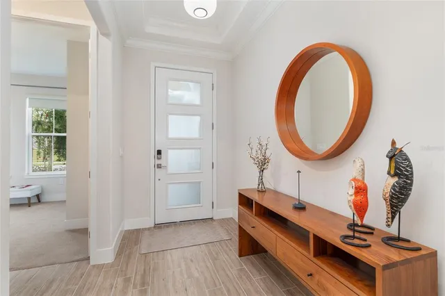 a kitchen with stainless steel appliances kitchen island granite countertop a sink a stove and chairs