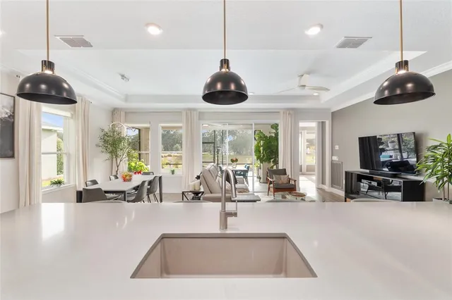 a spacious bedroom with a large bed and a large window