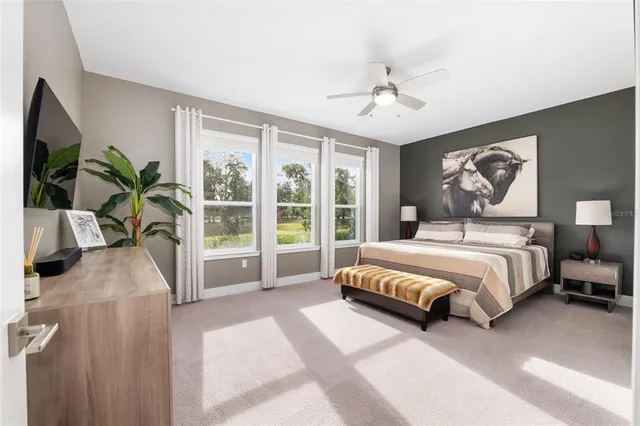 a bathroom with a granite countertop sink toilet mirror and shower