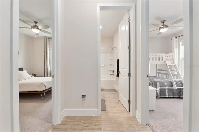 an aerial view of residential houses with outdoor space and ocean view