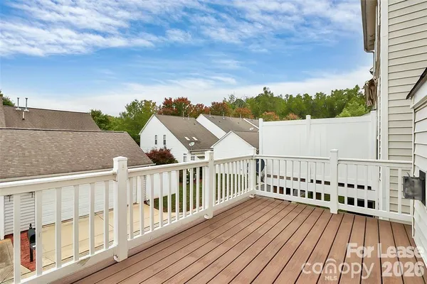 a view of balcony with wooden floor