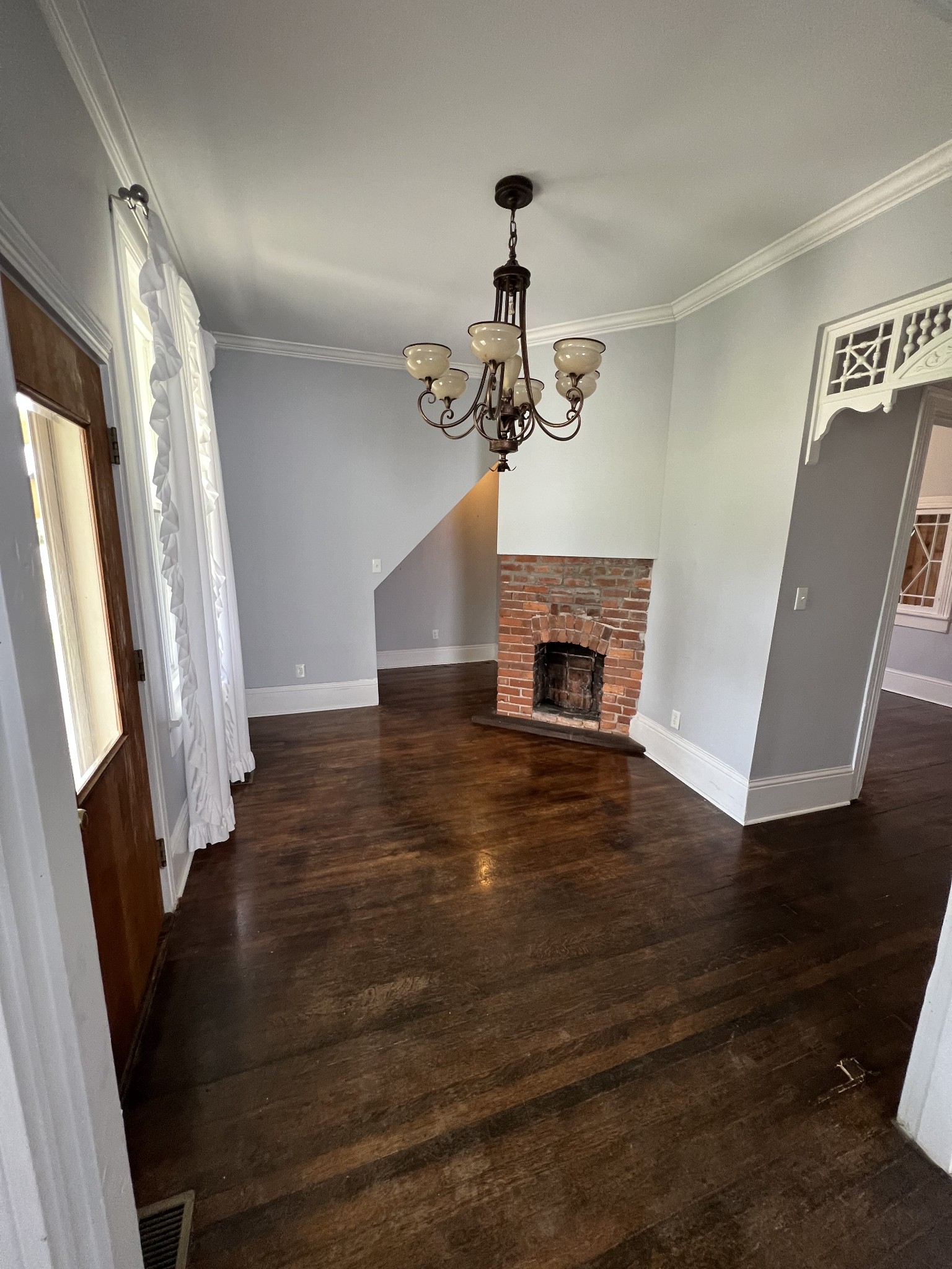 201 Pleasant Street Mount Pleasant, TN 38474 - Photo 6 of 38 a view of a livingroom with wooden floor and a staircase