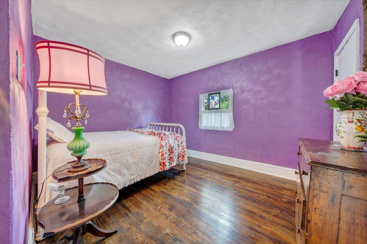 2410 Overlook Road Northeast Roanoke, VA 24012 - Photo 6 of 19 a bed room with a bed and a potted plant