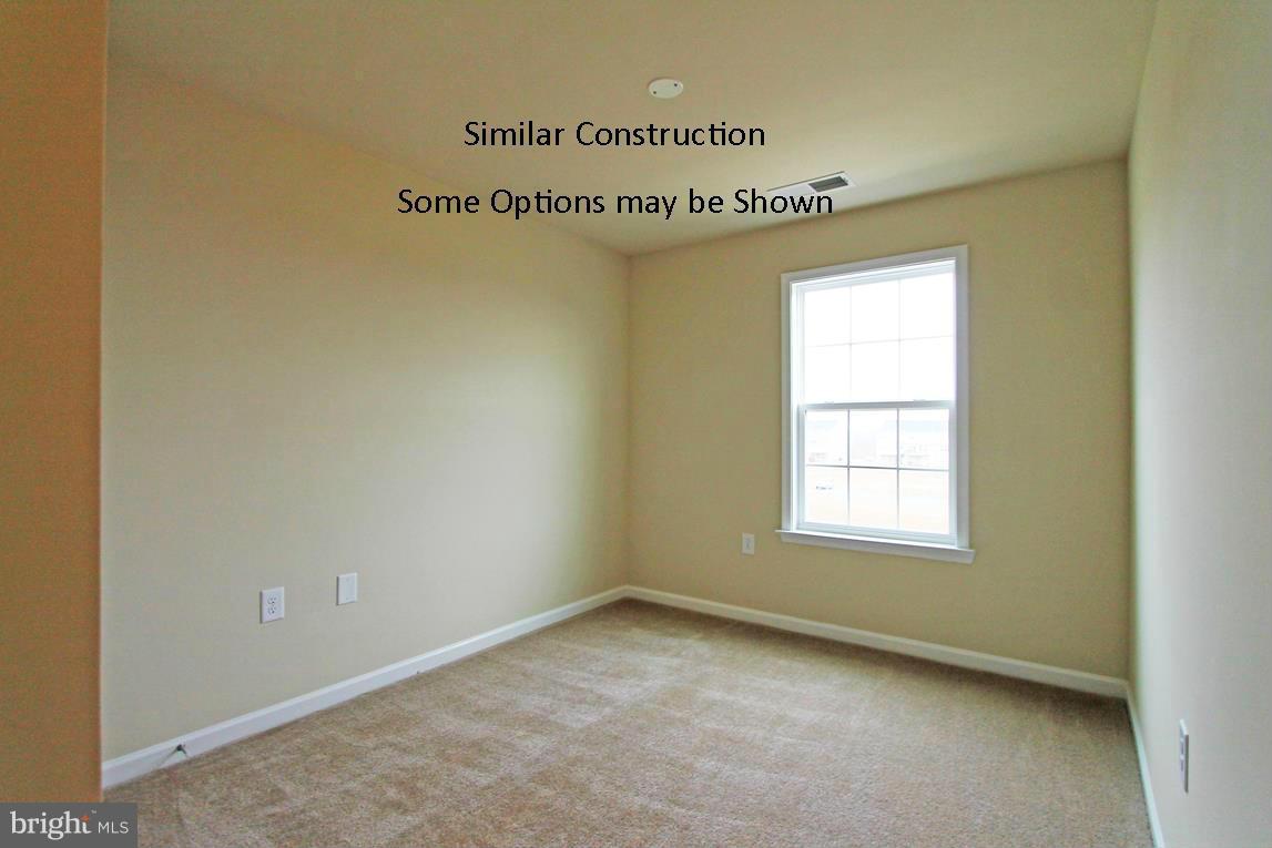 0 Stallion Street, Unit 408 Ranson, WV 25438 - Photo 20 of 30 an empty room with a window