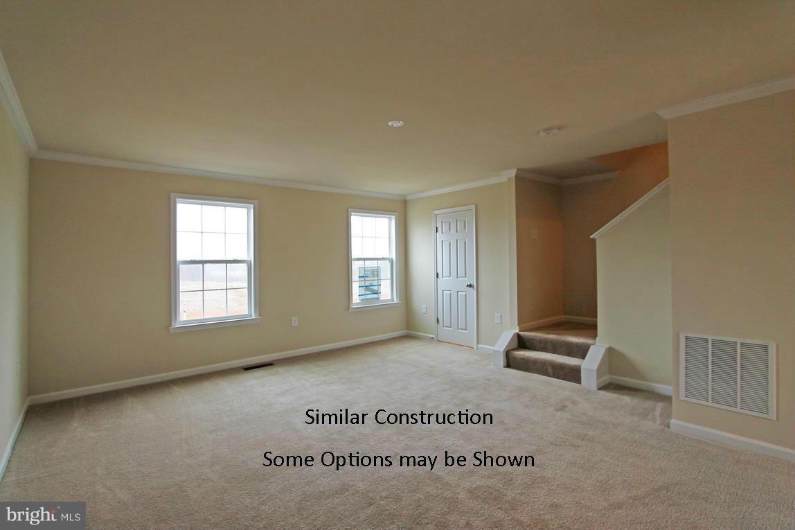 0 Stallion Street, Unit 408 Ranson, WV 25438 - Photo 7 of 30 an empty room with windows