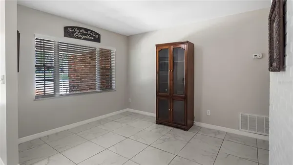 a view of wooden floor and windows in a room
