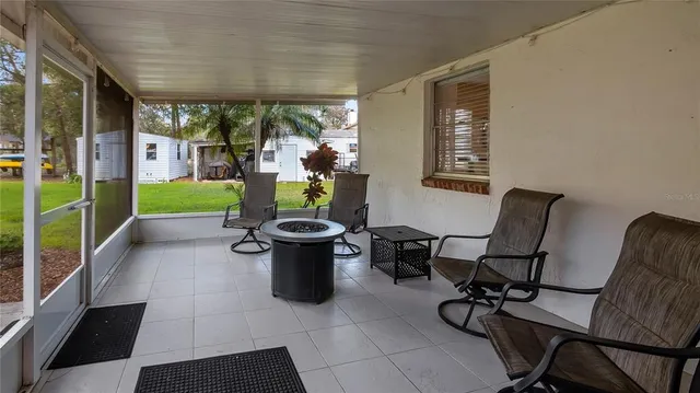 a view of a house with garden and sitting area