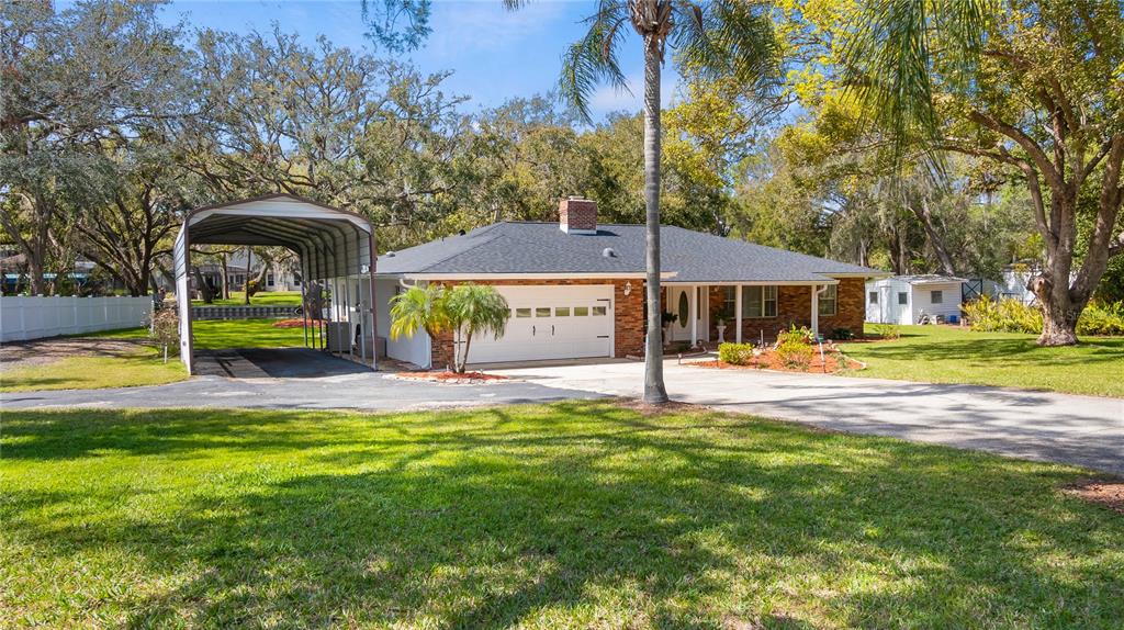 11136 Bronson Road Clermont, FL 34711 - Photo 26 of 29 a view of a house with swimming pool and sitting area