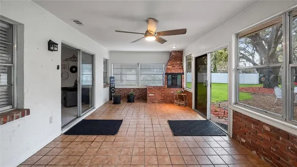 a dining room with furniture and a garden