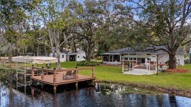 a view of a wooden chairs and fire pit in the city