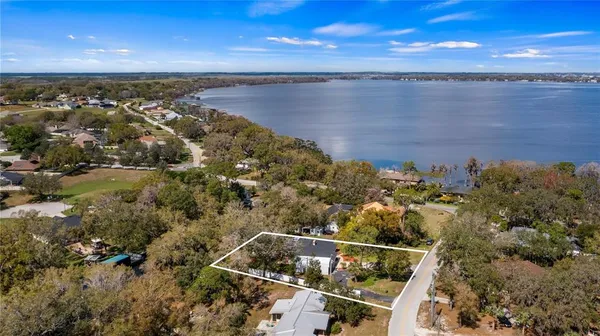 an aerial view of house with yard