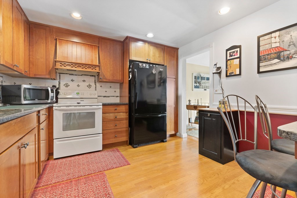 4 Peters Road Canton, MA 02021 - Photo 17 of 34 a kitchen with stainless steel appliances granite countertop a refrigerator a stove and a sink