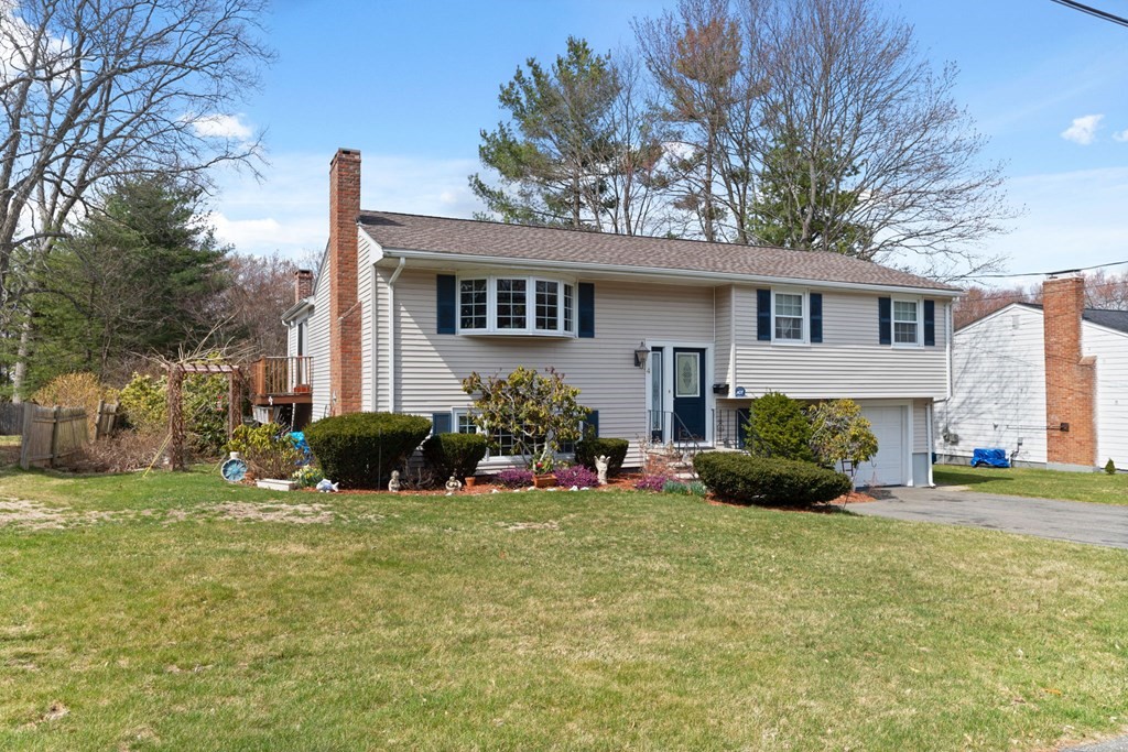 4 Peters Road Canton, MA 02021 - Photo 2 of 34 a view of a house with a yard and plants