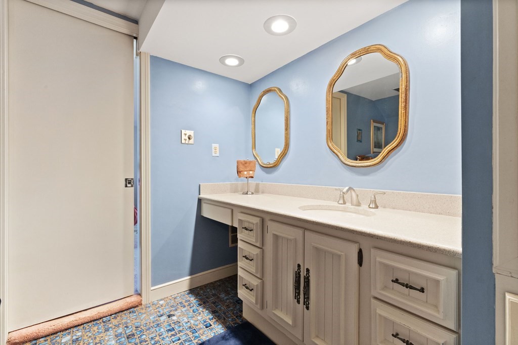 4 Peters Road Canton, MA 02021 - Photo 28 of 34 a bathroom with a double vanity sink and a mirror
