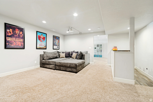 983 West 1550th Street South Springville, UT 84663 - Photo 40 of 43 Spacious entertainment area featuring recessed lighting, projector, and light-toned carpeting.