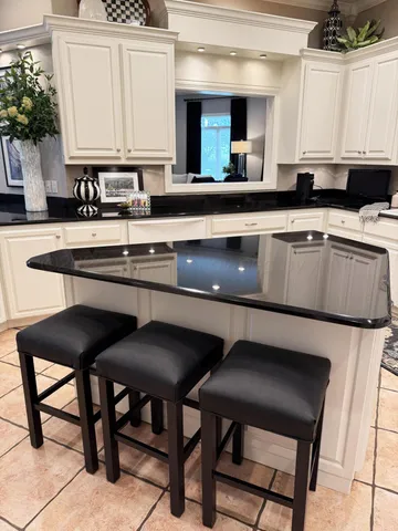 a view of swimming pool with outdoor seating and plants