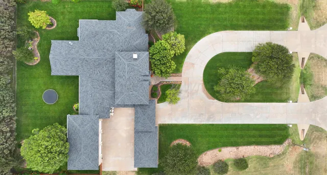 a kitchen with a sink cabinets and window
