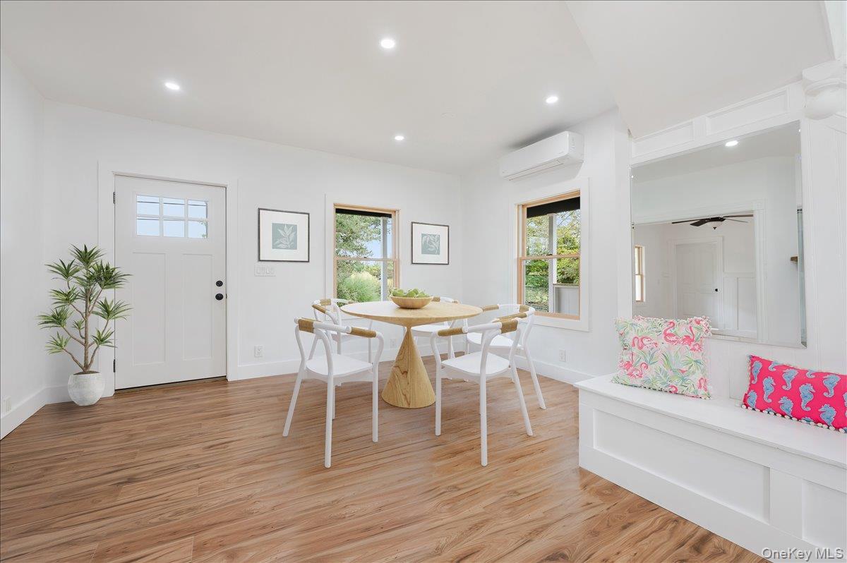 56 Oak Beach Road Babylon, NY 11702 - Photo 6 of 34 a living room with furniture a window and wooden floor