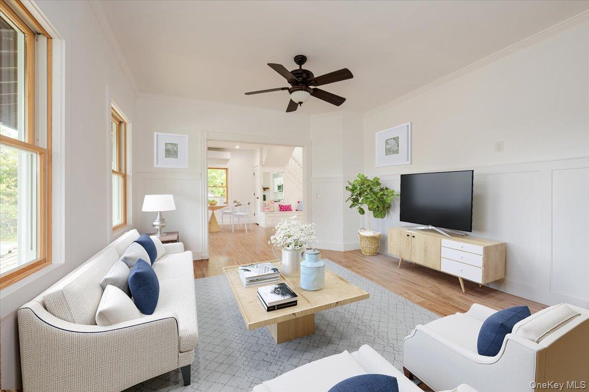 56 Oak Beach Road Babylon, NY 11702 - Photo 9 of 34 a living room with furniture and a flat screen tv