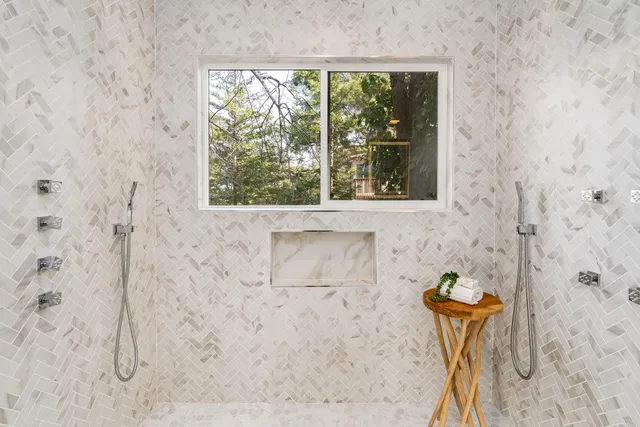 a bathroom with a bathtub and a shower