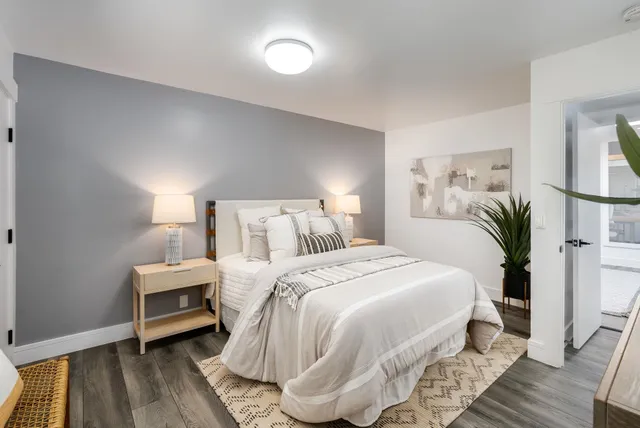 a bed room with a bed and a window