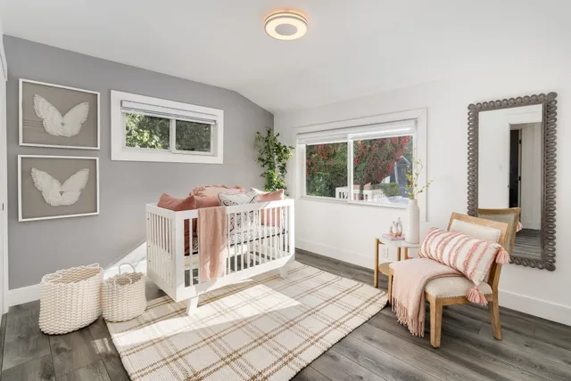 a bedroom with furniture and a window